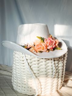 "Say hello to all your summer festivities this year with our unique lacy bohemian cowgirl hat! This chic structured cowboy hat is beautifully crafted with delicate white lace adding the perfect feminine touch and adorned with beautiful peachy florals for that ultimate bohemian desert look. It's the perfect unique accessory to complete your festival outfit or your next elopement/engagement shoot! High quality and thick string tie is included to secure your hat around your head. You can wear it on your head and/or tie behind your neck for versatile looks. Dimensions: Brim to Brim : 14\" Long x 12\" Wide x 5\" High Inside Head Slot: 8\" Long x 6.5\" Wide x 4.75\" High" Rustic Adjustable Hat Bands For Spring, White Western Hat For Spring, Adjustable Hat Bands For Country Events In Spring, White Country Fedora For Festivals, Country Style White Fedora For Festivals, Spring White Hat Band For Ranch, White Hat Bands For Spring Ranch, White Hat Band For Spring Ranch Occasions, Adjustable Mini Hats For Kentucky Derby And Country Events