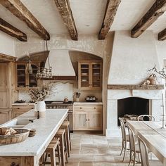 a large kitchen with an oven, stove and dining table