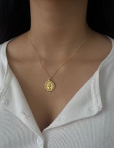 Gold Vintage Coin Pendant Necklace * Material: Gold Vermeil (High Quality Gold Plated over 925 Sterling Silver),  Pendant: 18k gold plating   * Finish: 18k Gold ∙ Sterling Silver * Measurements: Length: 17.32"(44cm); Pendant Length: 0.79"(1.9cm)  * Hypoallergenic     WHY YOU WILL LOVE IT   * Elegant and perfect for everyday wear * A timeless piece you'll always treasure  * High quality materials   PACKAGING  * All orders will be packaged nicely and secure! * Your jewelry will come with a soft cotton bag and cloth with a jewelry care guide that shows you how to give your pieces some extra love and care!  SHIPPING AND HANDLING     Free Shipping on All USA Orders! For International Orders - Please Calculate Shipping at Checkout   * All items will be fulfilled and shipped within 1-2 business d Gold Coin Pendant, Gold Medallion Necklace, Gold Coin Necklace, Gold Medallion, Coin Pendant Necklace, Dainty Gold Necklace, Medallion Necklace, Gold Coin, Layered Jewelry