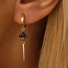 Real Gold Dangle Earring with sparkling Black Cz Gems We are producing the Dangle Earring in 10K, 14K, 18K gold  * 100% 14k  Solid Yellow Gold (Not Gold Vermail or Not Gold Plated) *  2,85gr/10K pair , 3,15gr/14K pair , 3,65gr/18K pair  * Sold as a pair   A+ Black Tone Cubic Zirconia clear simulated diamonds * Each Earring has 3pcs of marquise cut Cz Black Crystals * Drop Lotus+Spike Height: 4,5cm / 1,8inch * Polished finish EU and UK taxes; *EU and UK orders over £135/€150 are subject to custom Black And Gold Ear Piercings, Black Earrings Aesthetic, Black Outfit Gold Jewelry, Black Jewelry Aesthetic, Gold And Black Jewelry, Everyday Gold Earrings, Black And Gold Jewelry, Black And Gold Earrings, Fantasy Earrings