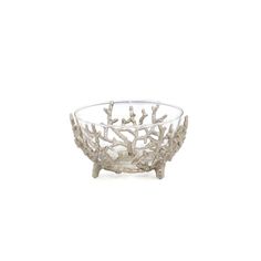 a glass bowl with branches in it