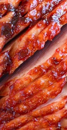 closeup of sliced meat with sauce on it