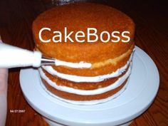 a cake with the words cakeboss on it is being cut by a knife