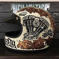 the helmet is decorated with an image of a motorcyclist's motorcycle