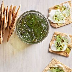 crackers and dip are arranged on a table