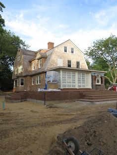 a large house is being built in the dirt