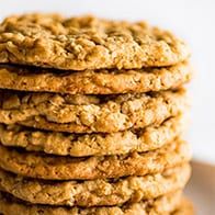 a stack of oatmeal cookies sitting on top of a white plate