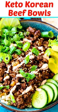 a bowl filled with beef and cucumber on top of a blue tablecloth