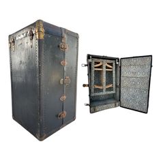 an old suitcase opened to show the inside and outside compartments, with no doors or handles