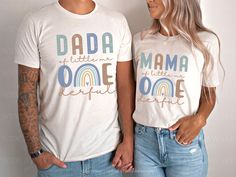 a man and woman standing next to each other wearing matching tshirts that read dada, mama, one beautiful life