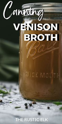 a jar filled with brown liquid sitting on top of a table