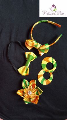 three pieces of colorful hair accessories sitting on top of a black surface