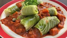 a plate filled with lettuce and meat covered in sauce