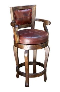 a wooden chair with leather upholstered on the back and arm rests against a white background