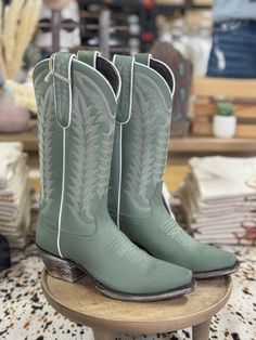 Gorgeous mint green style cowboy boots Ciel gumuza full grain leather Shaft height: 12" Heel: 1 1/2 Snip toe style and easy pull on Leather lining and cushioned footbed White boot stitch shaft embroidery Leather outsole Fits true to size White Cowboy Boots Wedding, Green Cowboy Boots, Style Cowboy Boots, Wedding Cowboy Boots, Liberty Black Boots, Cute Cowgirl Boots, White Cowboy Boots, Girl Cowboy Boots, Silver Boots