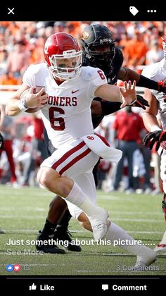 a football player is running with the ball