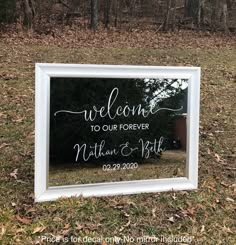 a white framed mirror with the words welcome to our forever written in cursive writing