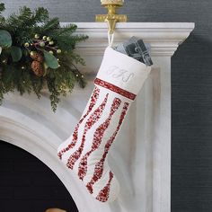 a christmas stocking hanging from a mantel