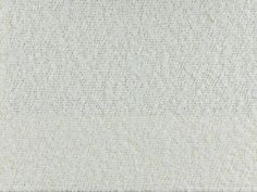 a white rug with small dots on it