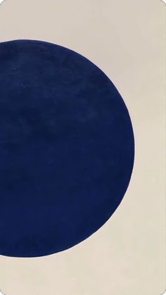 a blue and white circle on a beige background