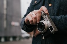 a man holding a camera in his hand