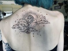 the back of a woman's upper body with clouds and stars in the sky