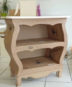 a small wooden shelf sitting on top of a tiled floor