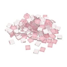 pink and white squares are scattered on a white surface, with one square in the middle