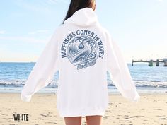 Ride the waves of positivity with our "Happiness Comes in Waves, Catch the Swell" hooded sweatshirt! Embrace the ebb and flow of life with this stylish reminder to seize every moment and ride the highs. Whether you're hitting the beach or navigating life's currents, let this hoodie inspire you to catch the swell of happiness wherever it may take you. This fabulous graphic will be printed on a Gildan 18500 Unisex Hoodie which runs true to size. If you are looking for a roomy fit, we recommend siz Happiness Comes In Waves, Summer Hoodie, Coconut Girl Aesthetic, Positive Hoodie, Merch Ideas, Ebb And Flow, Aesthetic Hoodie, Vsco Girl, Coconut Girl