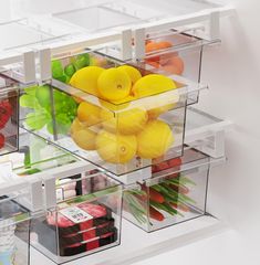 plastic containers filled with different types of fruits and vegetables in them, all stacked on top of each other