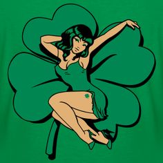 a woman in a green dress sitting on top of a clover shaped flower with her arms stretched out