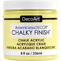 a jar of chalk that is yellow and has white writing on the bottom, with black lettering