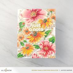 a card with flowers on it that says just a note