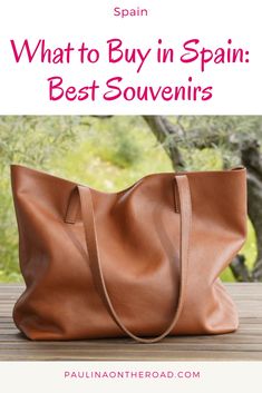 a brown leather bag with the words what to buy in spain best souvenirs