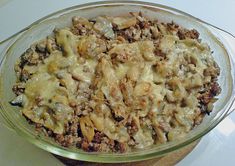 a casserole dish filled with meat and cheese