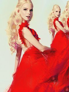 a woman in a red dress with long blonde hair