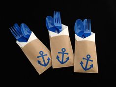 three bags with blue forks and an anchor on them