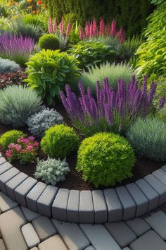 a garden filled with lots of different types of flowers and plants on top of a brick walkway