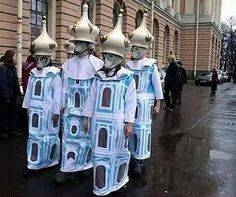 two people in costumes walking down the street