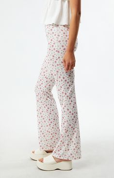 Step into springtime elegance with the Floral Knit Flare Pants from LA Hearts, showcasing delicate pointelle knit fabric adorned with a vibrant floral print. Designed with a flattering mid-rise fit, an elastic waistband, and flared leg openings, they effortlessly combine comfort and style for a chic and feminine look.


	10" rise
	31" inseam
	Mid-rise
	Floral print
	Elastic waistband
	Flared leg openings
	Model is wearing a size small
	Model measurements: 5’10” height, 31” bust, 23.5” waist, 34.5” hips Knit Flare Pants, Spring Pajamas, Heeled Rain Boots, High Heel Rain Boots, Pointelle Knit, Floral Knit, Trouser Pants Women, Floral Leggings, Feminine Look