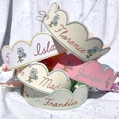 there are many heart shaped boxes with names on them