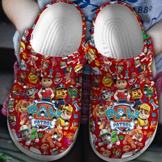 Paw Patrol Cartoon White Red Clogs Shoes Red Slip-on Slippers With Rubber Sole, Red Synthetic Slippers, Red Non-slip Slip-on Slippers, Fun Synthetic Clogs With Rubber Sole, Red Synthetic Closed Toe Slippers, Red Non-slip Casual Clogs, Red Non-slip Synthetic Clogs, Casual Clogs With Red Sole And Round Toe, Casual Red Non-slip Clogs