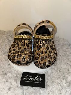 "MyStyleMyWay's  custom crocs are designed for the perfect outfit, that special occasion, and \"Just Because\" you love blinged out crocs.  In the display shown we designed a pair of tan \"Cheetah Print Design\" classic crocs adding high quality colorful rhinestones. 🐆Each Rhinestone is individually and neatly placed to achieve the design.  🐆Rhinestones are added to the top and buttom trimming of the shoe.  🐆This design was personalized. 🐆The sports mode strap is also designed.   🐆Fur Lining is included in this design  🐆This design do not have charms or patches. charms can be added please contact us directly to discuss charm options.  🐆When making your purchase - You're making a purchase for the exact style shown. If you would like a different color rhinestone,  and or different cha Leopard Crocs With Charms, Cheetah Crocs, Blinged Out Crocs, Bedazzled Crocs, Crocs With Charms, Cheetah Print Design, Womens Clogs And Mules, Custom Crocs, Classic Crocs