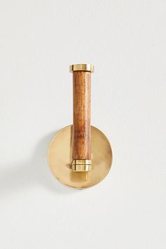 a wooden handle on a white wall