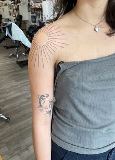 #CoolTattoos #TattooArt #InkMaster #TattooDesigns #InkedUp #TattooLovers #InkInspiration #TattooIdeas #CreativeInk #TattooStyle Sun Line Work Tattoo, Upper Arm Sun Tattoo, Sunshine Tattoo Shoulder, Sunburst Tattoo Shoulder, Sun Tattoo Inner Arm, Simple Shoulder Tattoos For Women, Star Tattoo Shoulder, Sun Tattoo On Shoulder