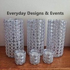 three silver vases sitting next to each other on a wooden table with the words everyday designs & events above them