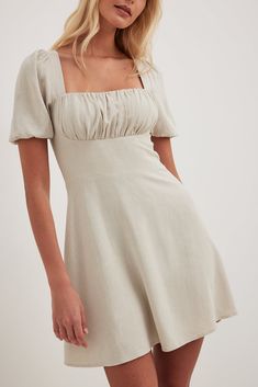 This mini dress is non-stretchy and features a linen blend. It has a square neckline and a ruched detail on the chest. This mini dress features puff sleeves with elasticized seams, a flowy fit, a self-tie band, a smocked, squared back and a hidden zipper on the side. Tie Up Dress, Kate Dress, Sleeves Dress, Future Fashion, Waterproof Jacket, Mini Dress With Sleeves, Na Kd, Tie Backs, Short Dress