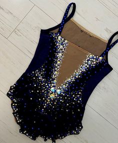 a women's bathing suit with sequins on it