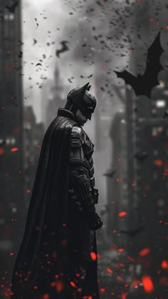 the dark knight stands in front of a city skyline with bats flying around his head