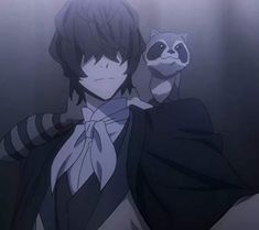 an anime character with a raccoon on his shoulder in front of the camera